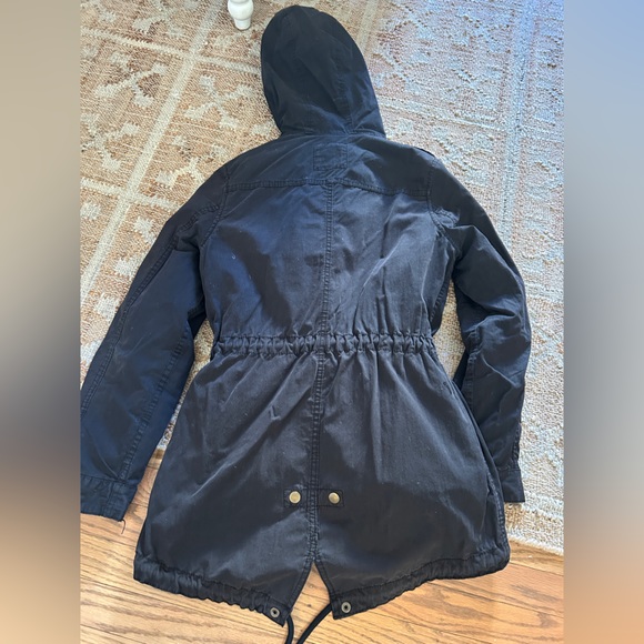 Black weather resistant mid-length jacket with quilted insert. - Picture 3 of 7